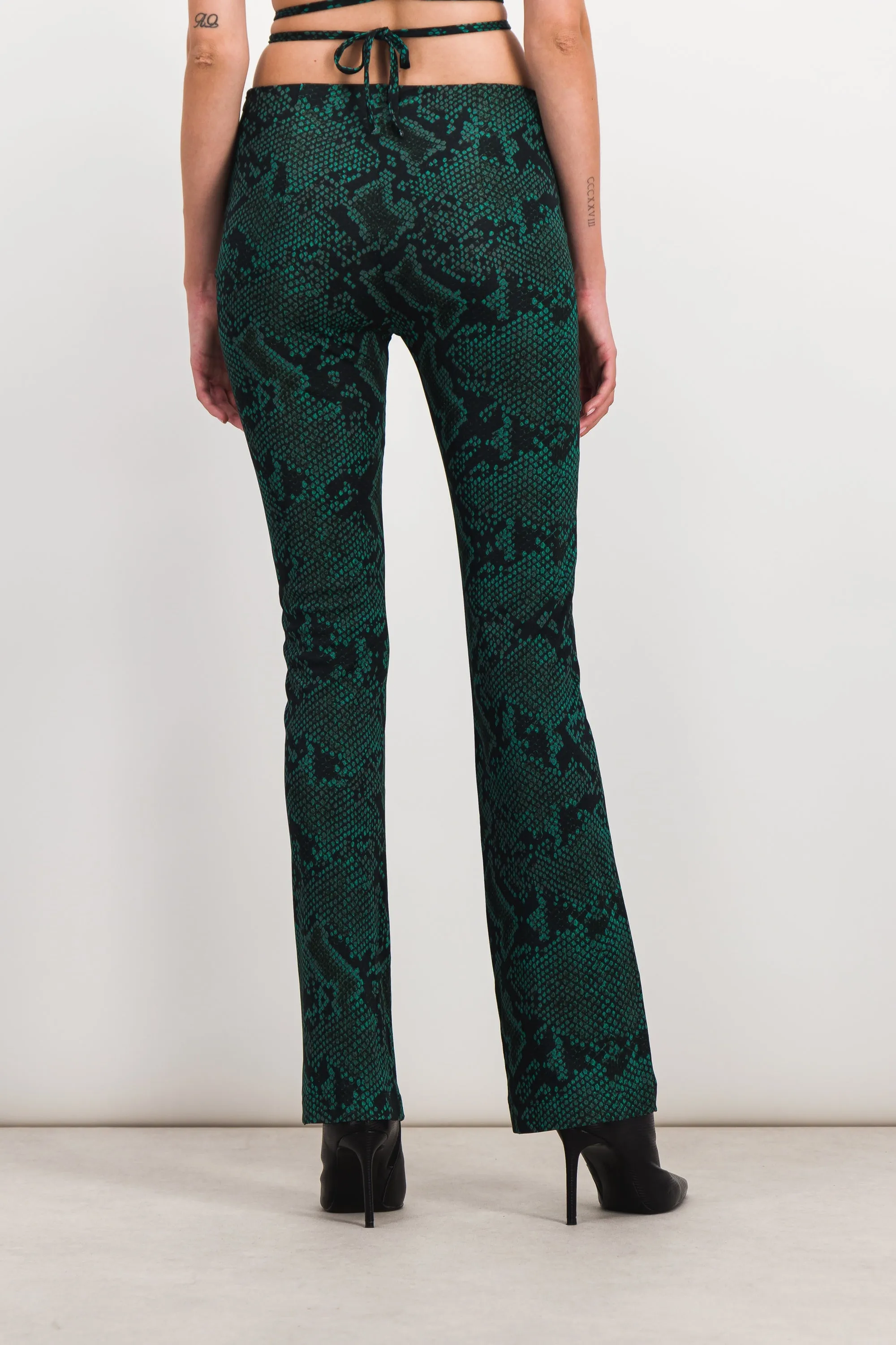 Green snake print slim straight leg pants